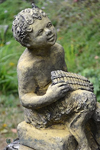 Statua pan che gioca - che,